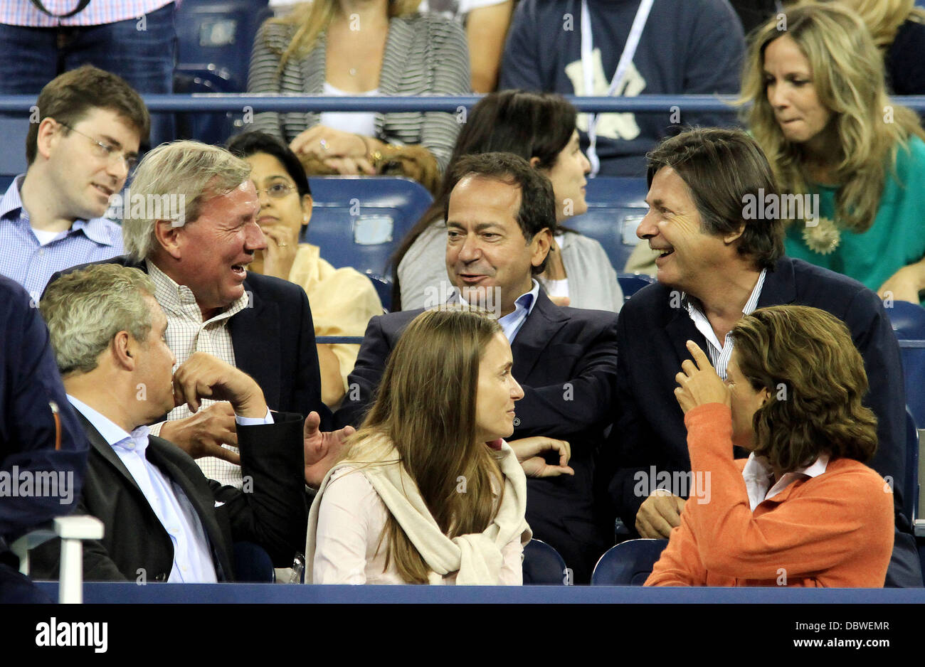 Hedge-Fund Billionaire John Paulson, having a laugh with friends during the  match between Novak Djokovic, SRB, and Carlos Berlocq, ARG, Thursday  September 1, 2011, on Day 4, of the US Open Tennis