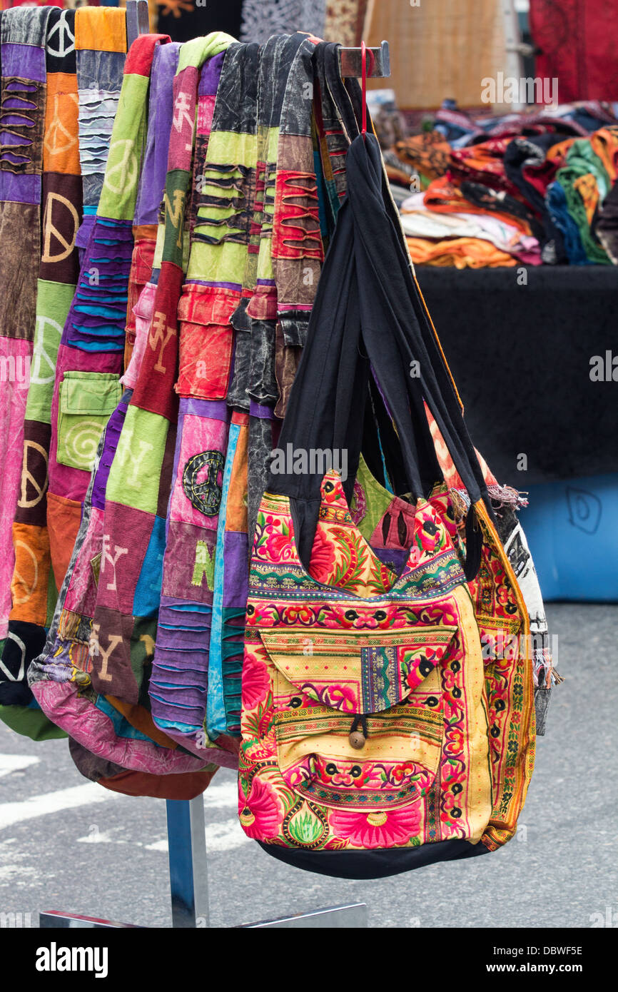 vendor illegally selling imitation name brand handbags on Canal Street  Manhattan New York Stock Photo - Alamy