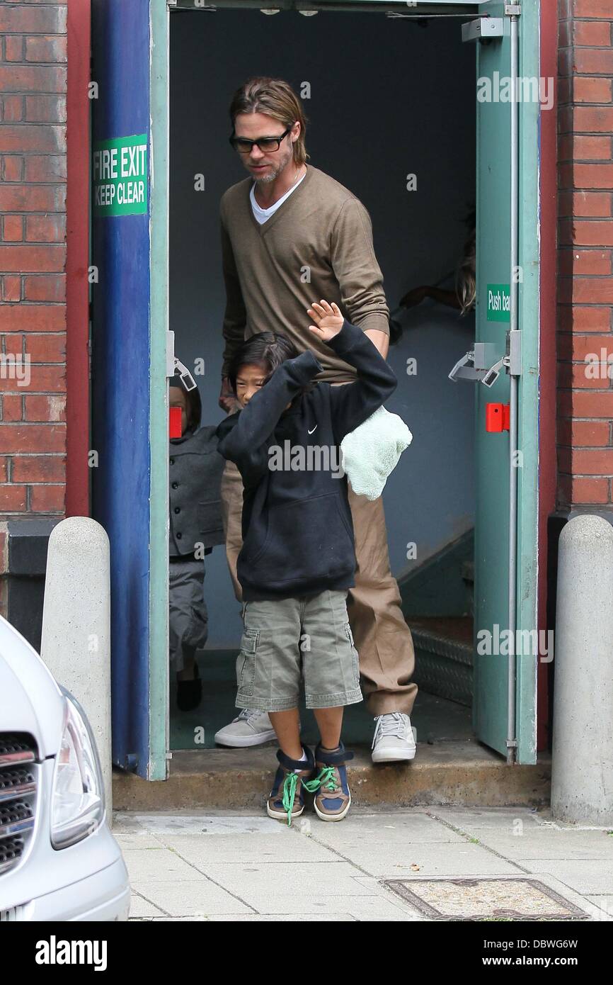 Brad Pitt with son Pax Thien Jolie-Pitt  leaving the cinema, after catching a morning screening Surrey, England - 04.09.11 Stock Photo