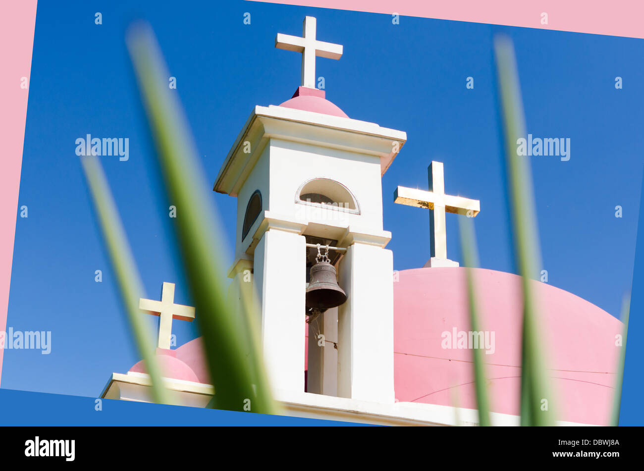 Pink domes and golden crosses on Greek Orthodox Church of the Seven Apostles in Capernaum Stock Photo
