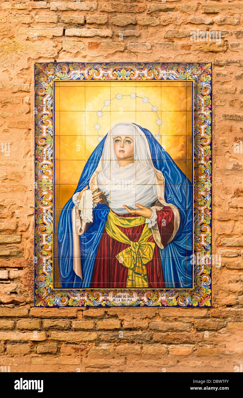 'Madre de Dios de la Palma', tiles on a wall in a street of Seville, Spain. Stock Photo
