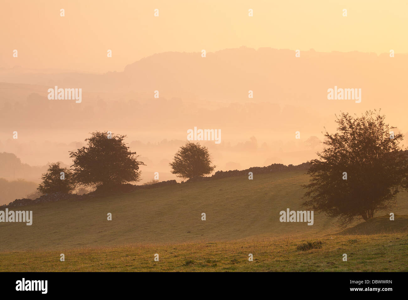Early morning sunrise over the Peak District hills Stock Photo