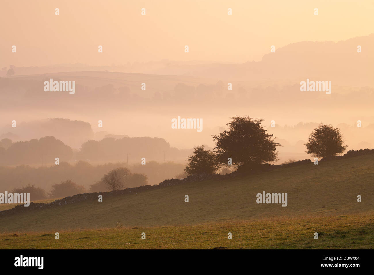 Early morning sunrise over the Peak District hills Stock Photo