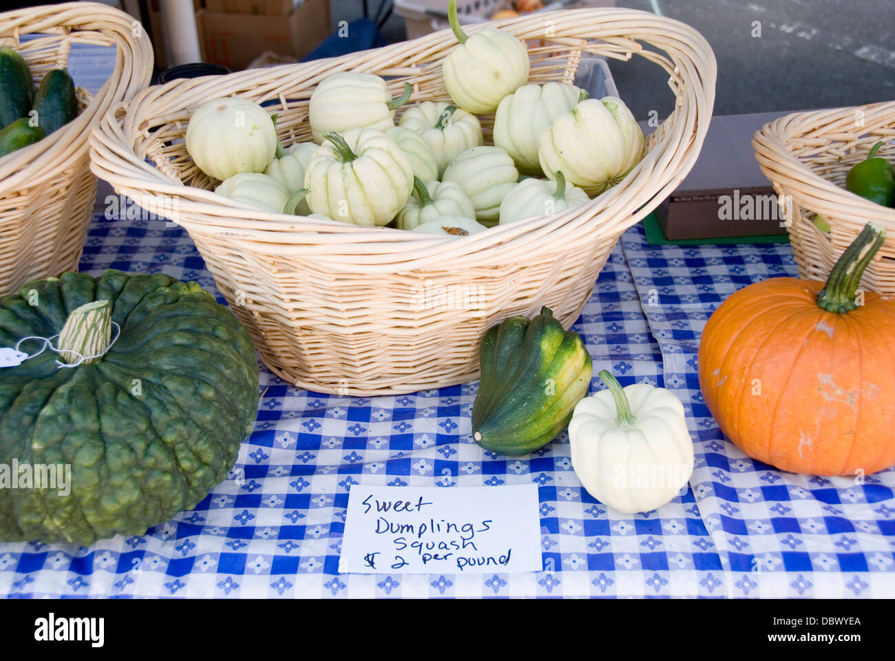 Selection of squash for sale on a stall selling fresh vegetables at the