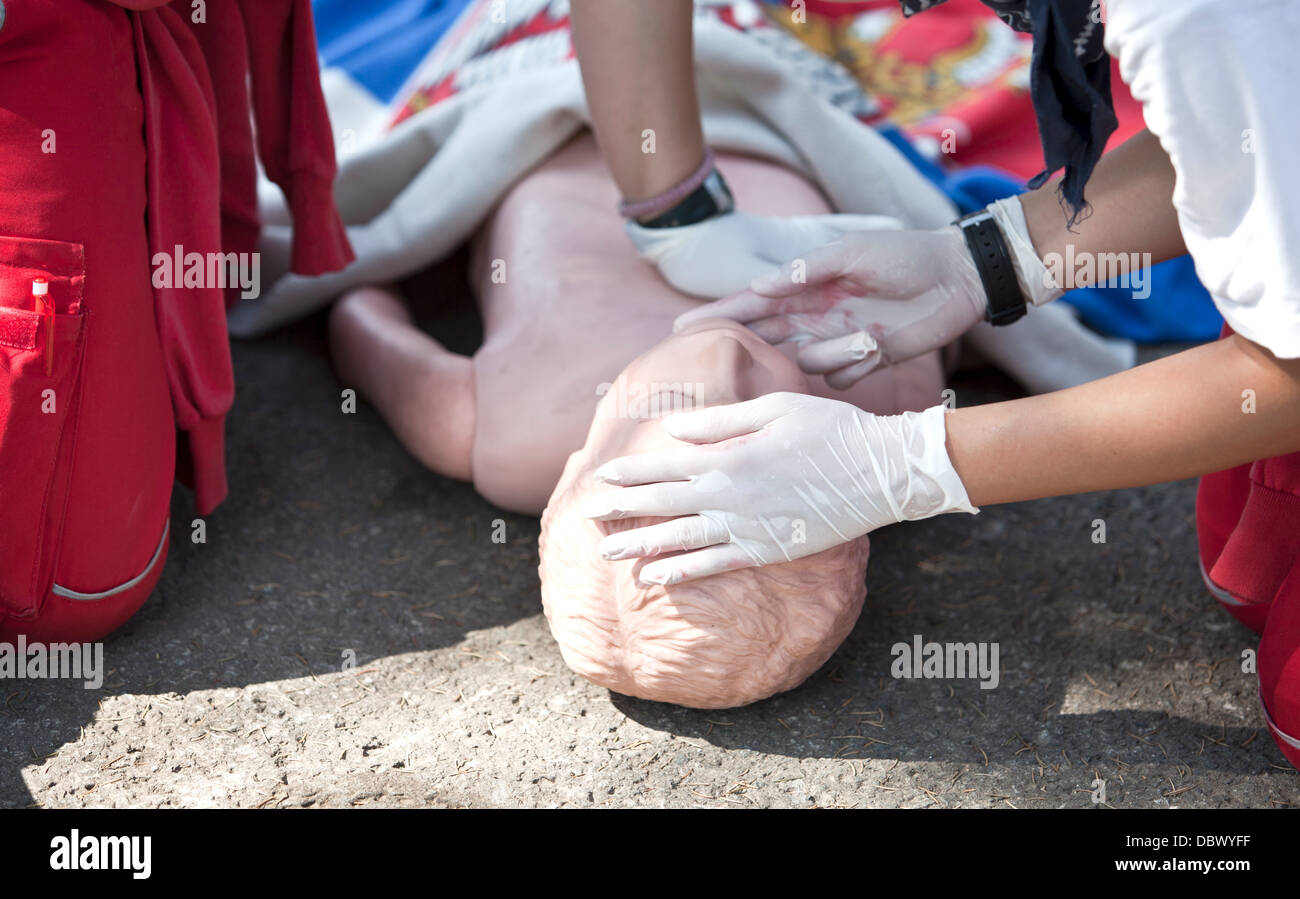 first aid training pulse checking Stock Photo - Alamy