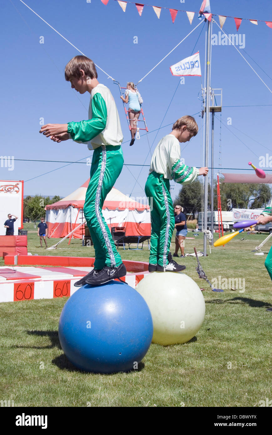 Two boys walking on balls, Wenatchee Youth Circus performance, Ellensburg,  Kittitas, Washington, USA Stock Photo - Alamy