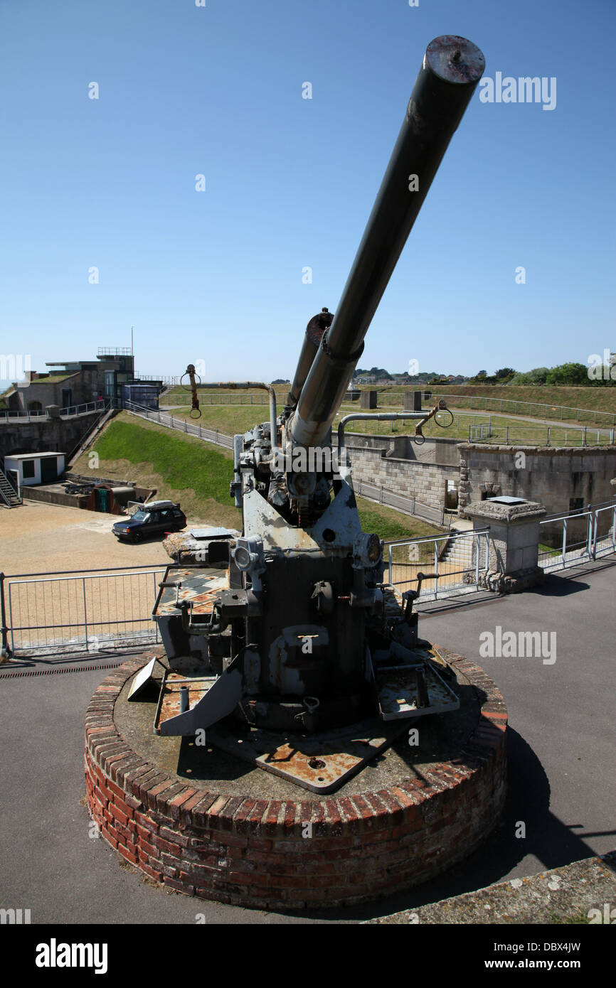 An old World War 11 anti-aircraft gun guards the fort on the south coast of England Stock Photo