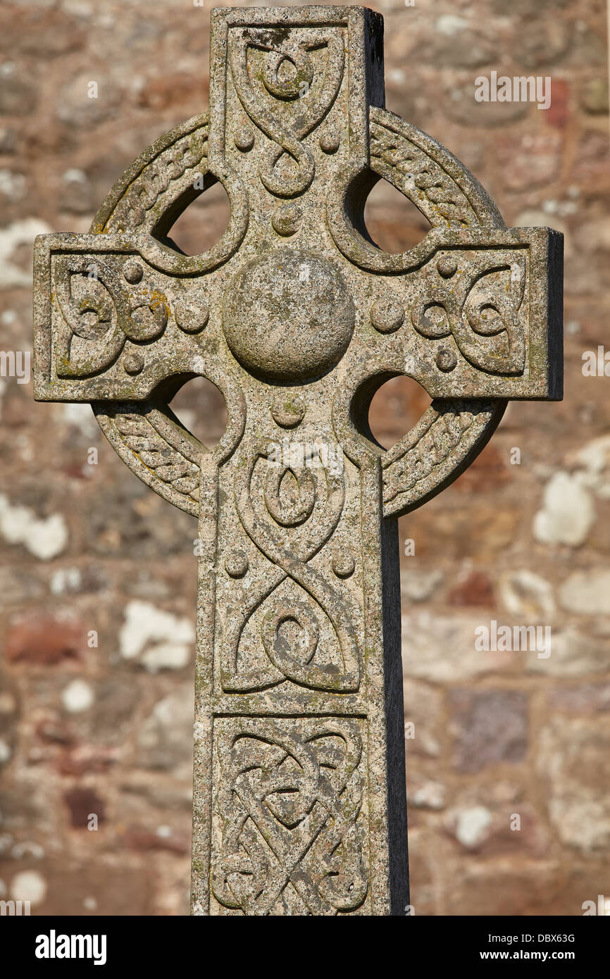 A Celtic cross in a churchyard in Woodbury, near Exeter, Devon, Great Britain. Stock Photo