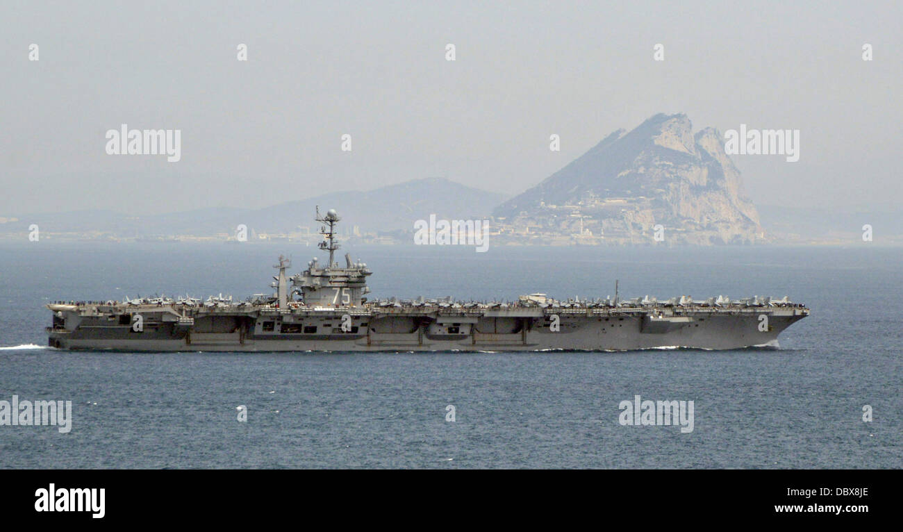 US Navy aircraft carrier USS Harry S. Truman passes the Rock of Gibraltar as it enters the Mediterranean Sea August 3, 2013. Stock Photo
