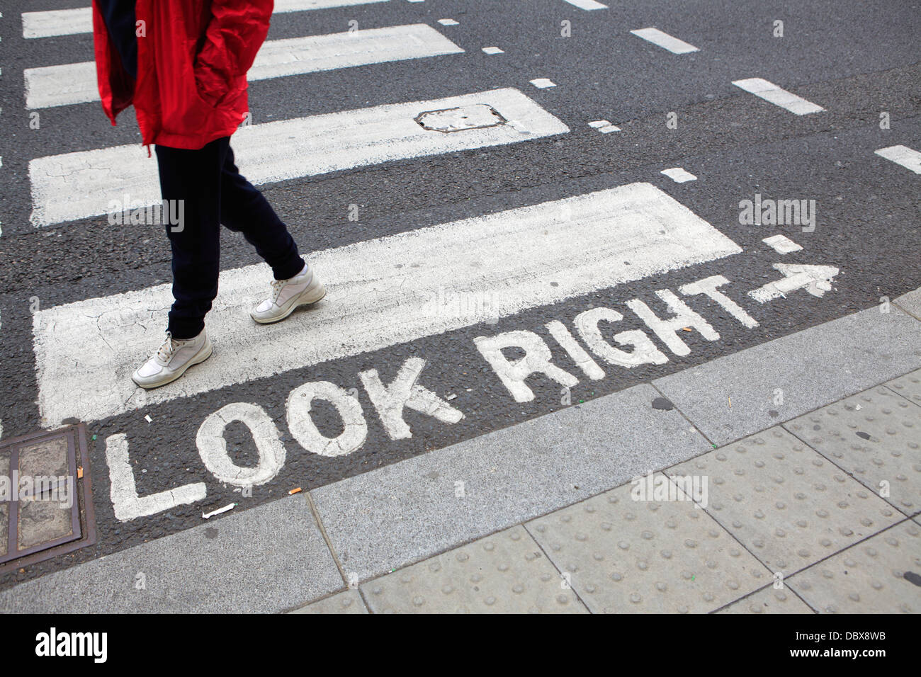 Crosswalks with 'look right' warning, London, UK Stock Photo