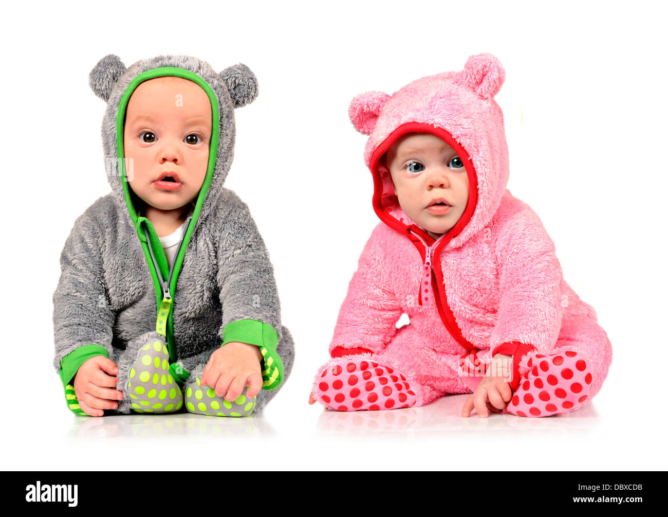 Six month old twin brother and sister on white Stock Photo - Alamy