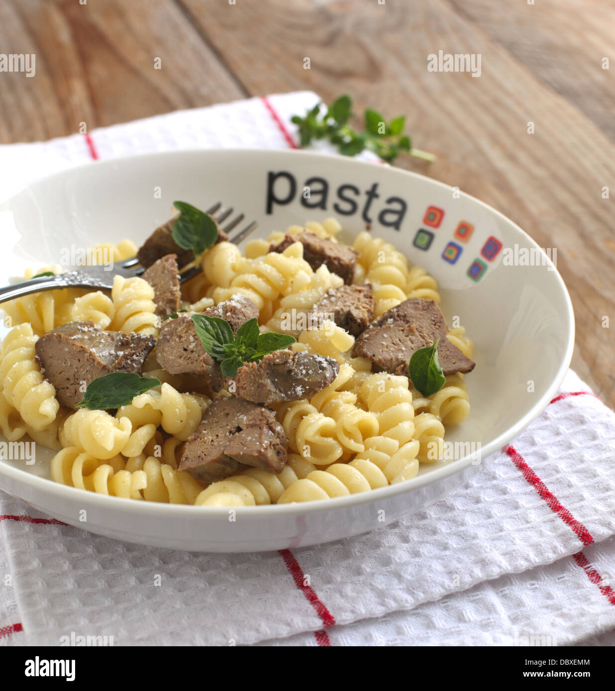 Pasta. Fusilli pasta with chicken liver, oregano and parmesan cheese