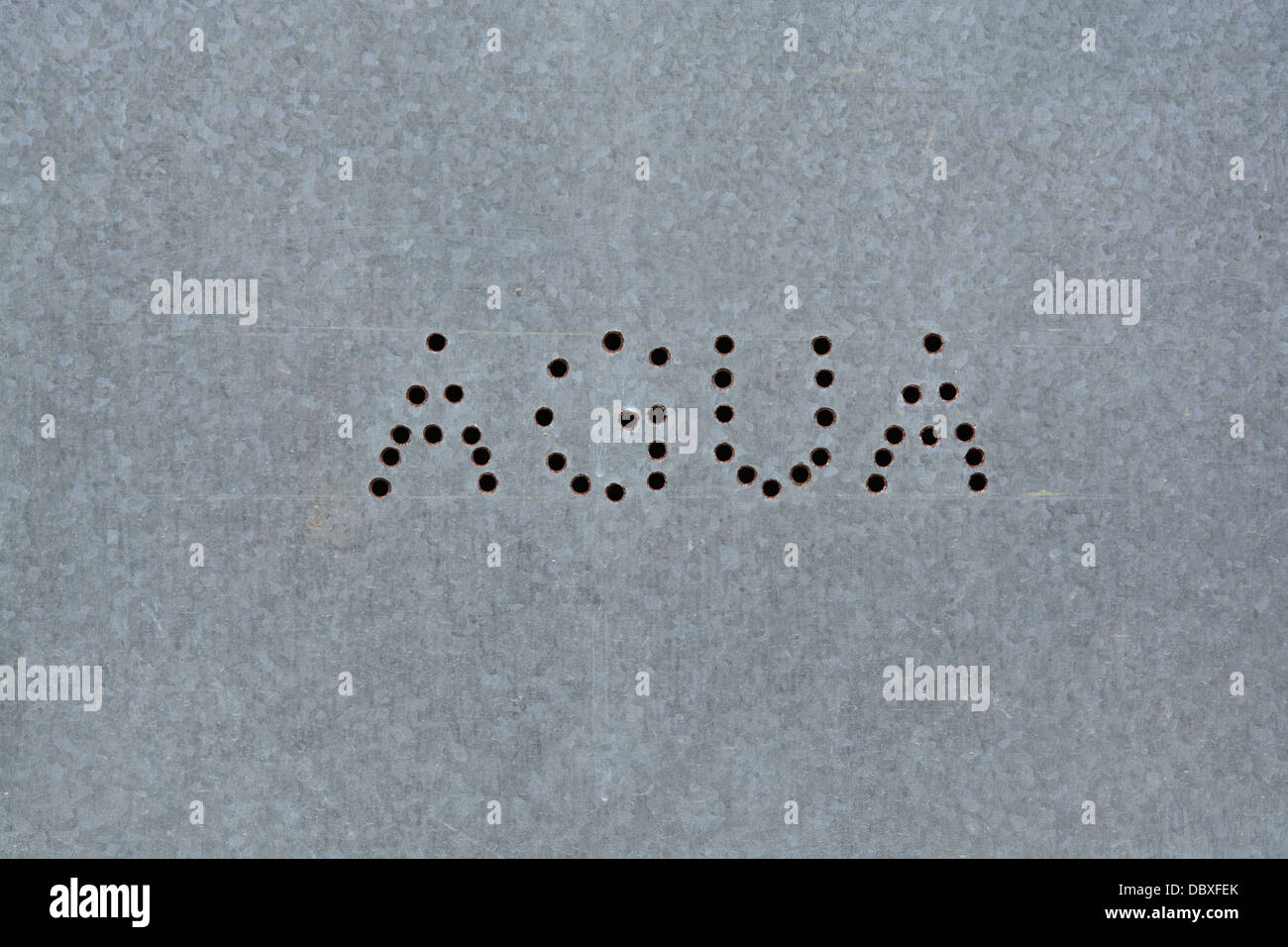 Spanish text agua on zinc board seen in a public street in Porto Petro