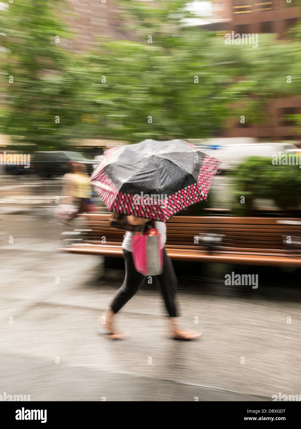 Female Pedestrian with a Colorful Umbrella, NYC, USA Stock Photo - Alamy