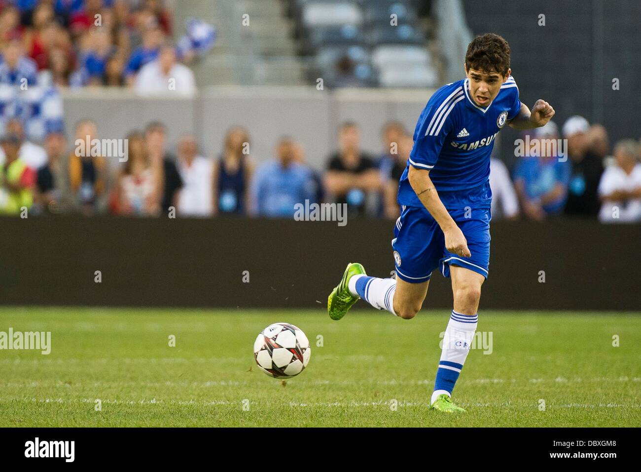 East Rutherford, New Jersey, USA. 4th Aug, 2013. August 04, 2013: Chelsea midfielder Oscar (11) stumbles with the ball during the Guinness International Champions Cup match between A.C. Milan and Chelsea at Met Life Stadium, East Rutherford, NJ. © csm/Alamy Live News Stock Photo