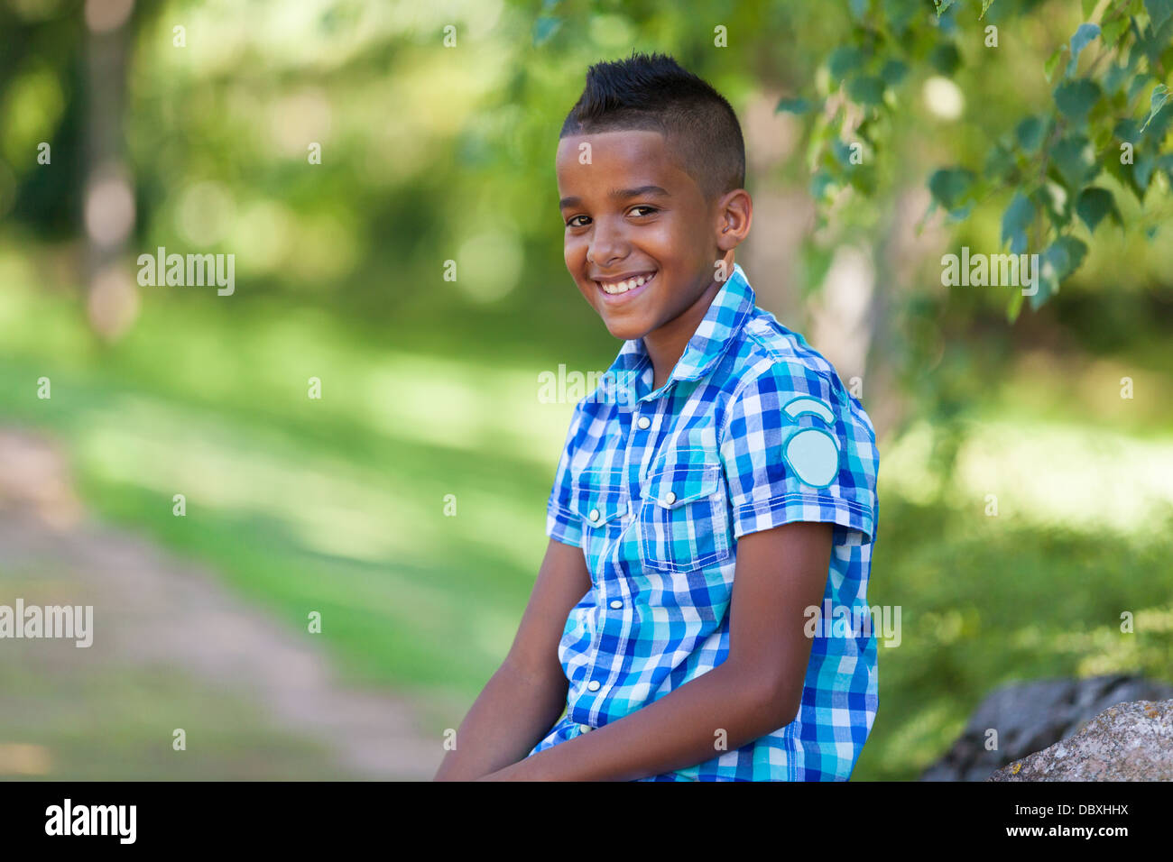 Outdoor portrait of a cute teenage black boy - African people Stock Photo