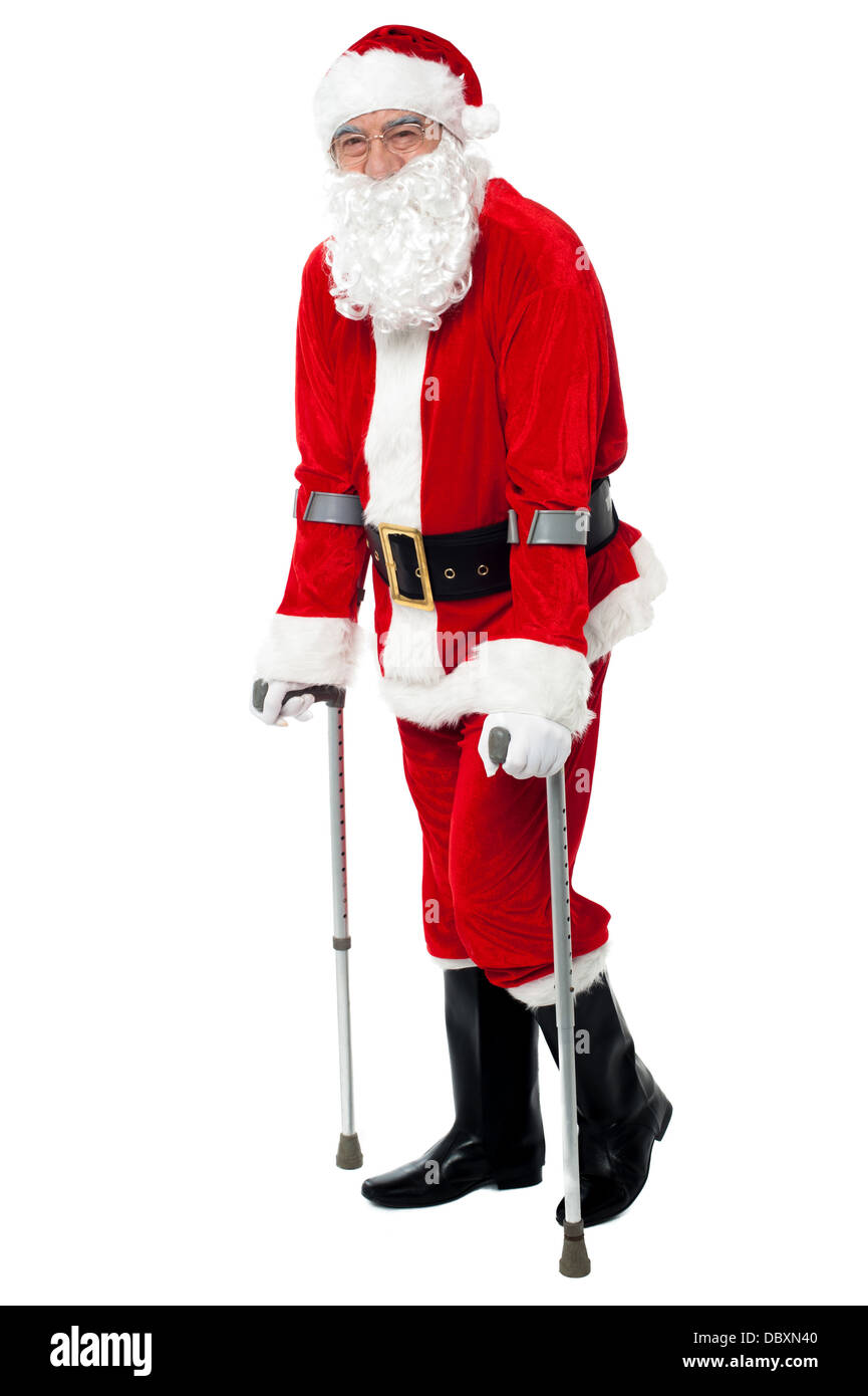 Santa Using A Walker Santa walking with the help of crutches Stock Photo - Alamy