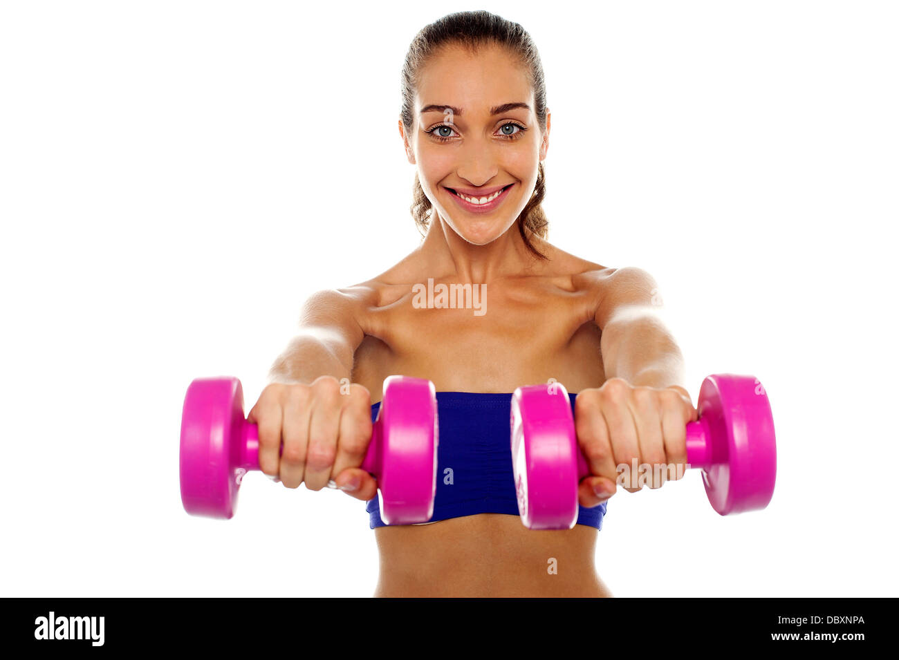 Lady lifting dumbbells, arms outstretched Stock Photo Alamy