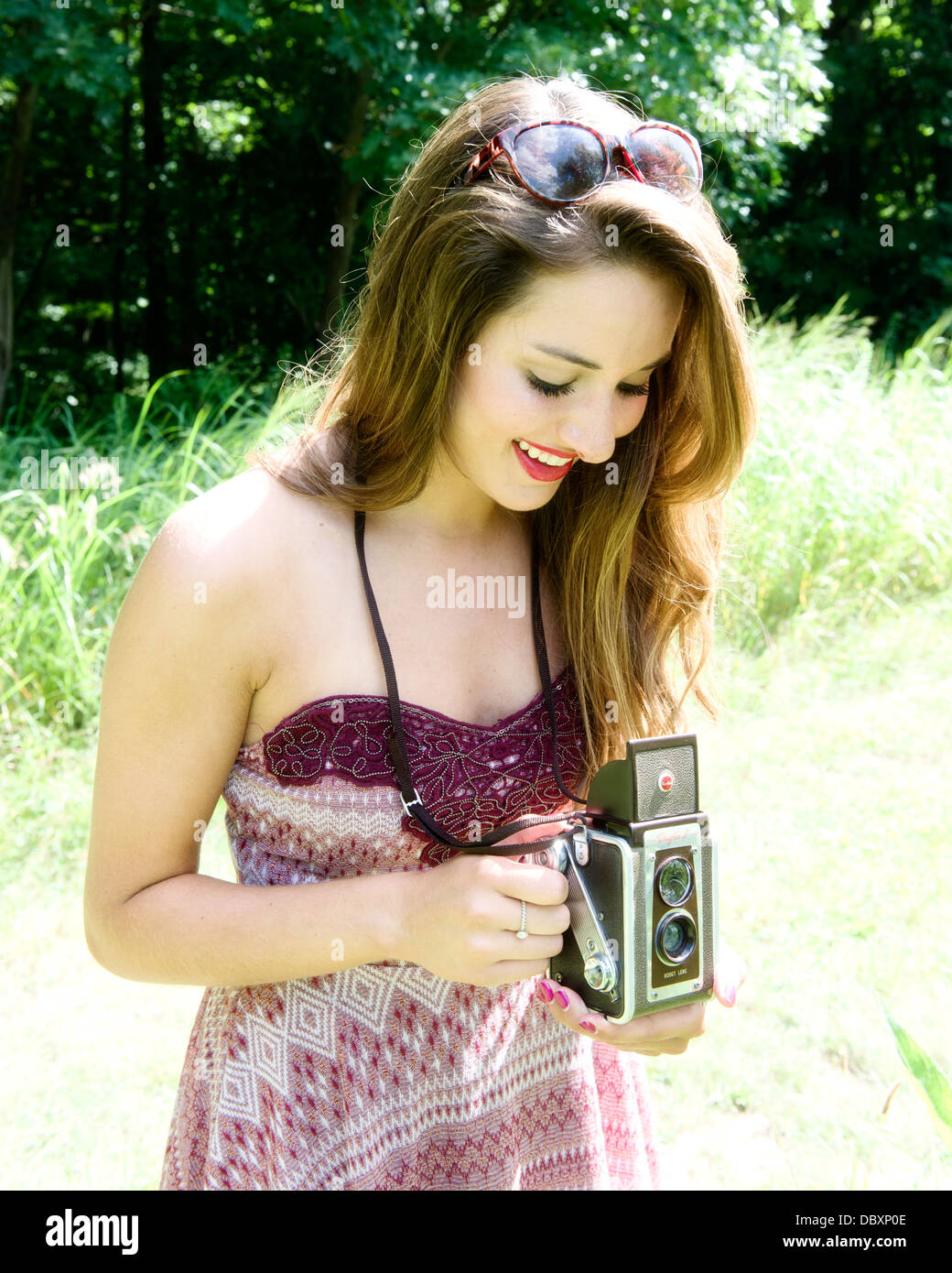 Young woman with a vintage camera Stock Photo