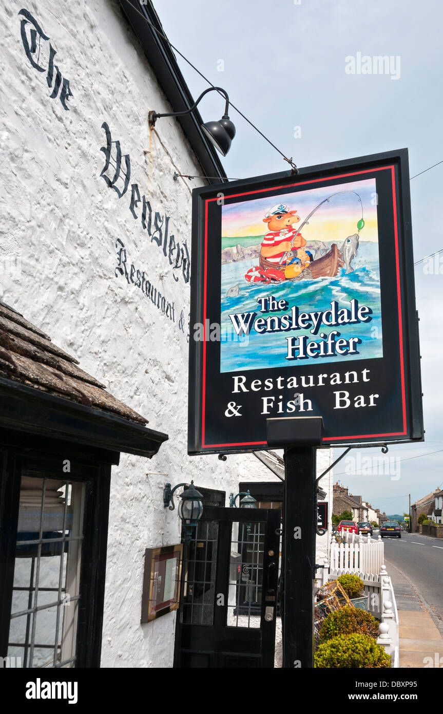 Great Britain, England, North Yorkshire, West Witton, The Wensleydale Heifer, Restaurant & Fish Bar sign Stock Photo