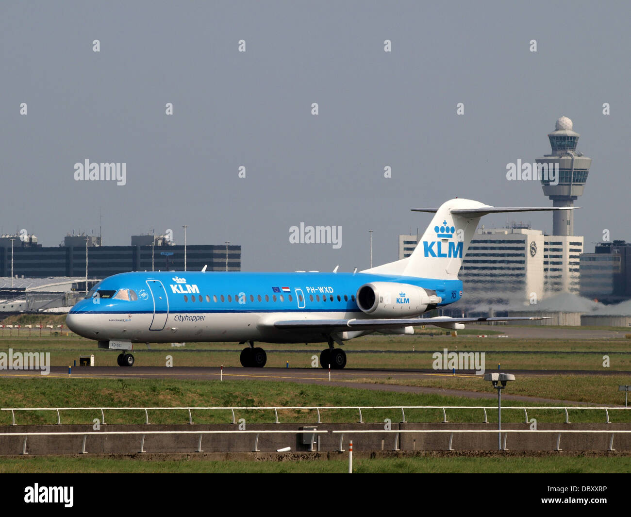 PH-WXD KLM Cityhopper Fokker F70 - cn 11563 13july2013 taxiing with Schiphol tower Stock Photo
