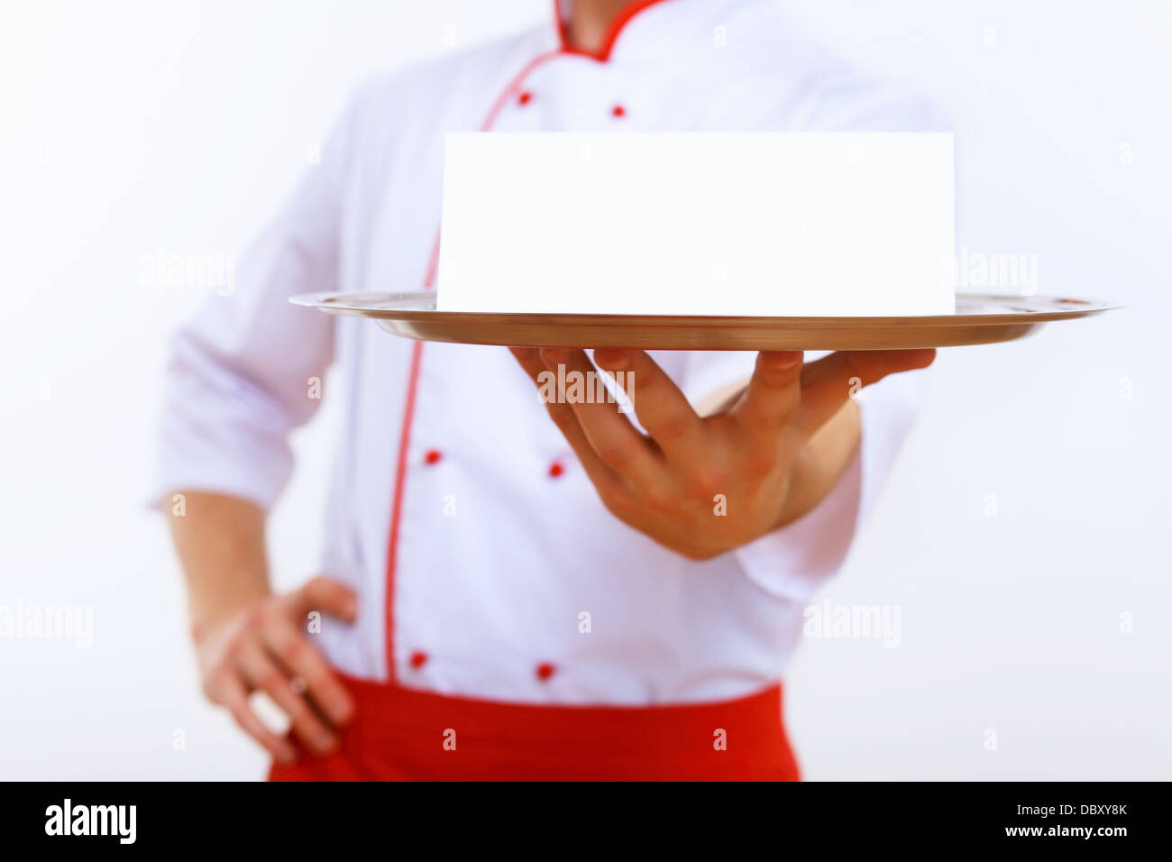 Cook holding an empty tray Stock Photo