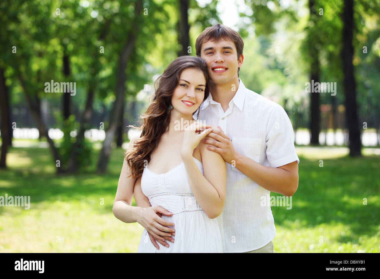 Young love Couple smiling under blue sky Stock Photo - Alamy