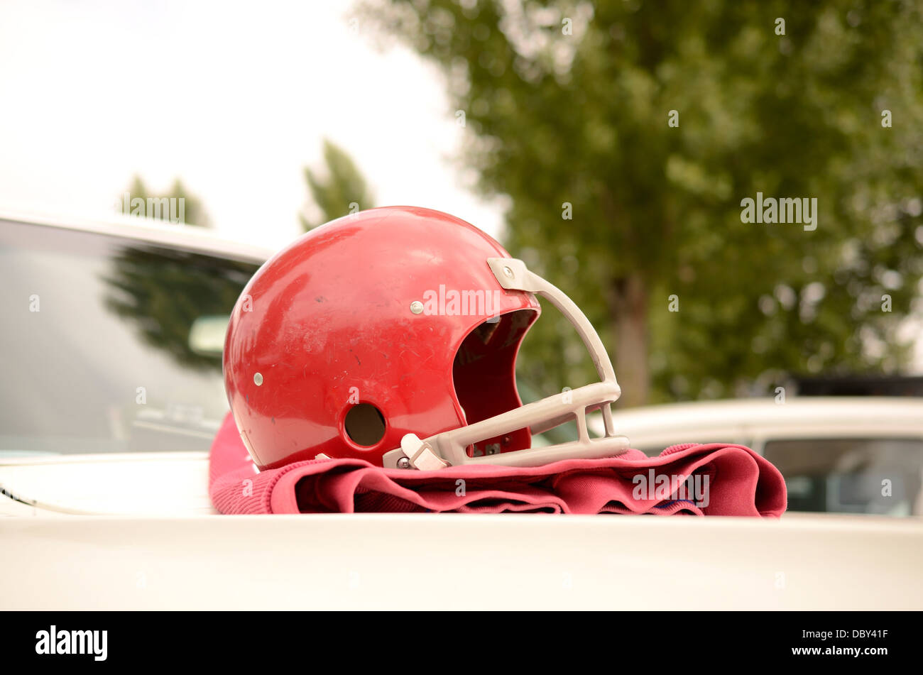 Football helmet on an American vintage car Stock Photo - Alamy