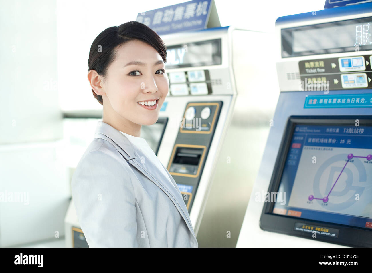 Young businesswoman at metro ticket machine Stock Photo - Alamy