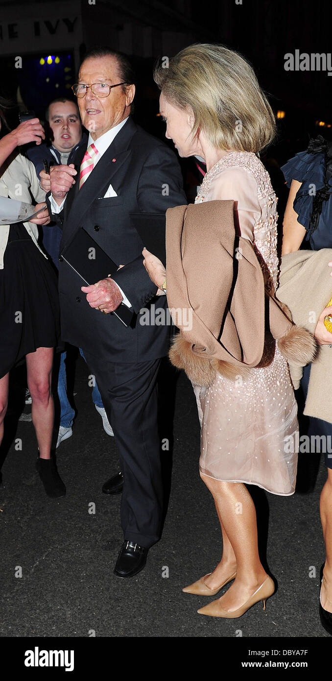 Sir Roger Moore and his wife Kristina Tholstrup leaving The Ivy restaurant. London, England - 12.09.11 Stock Photo