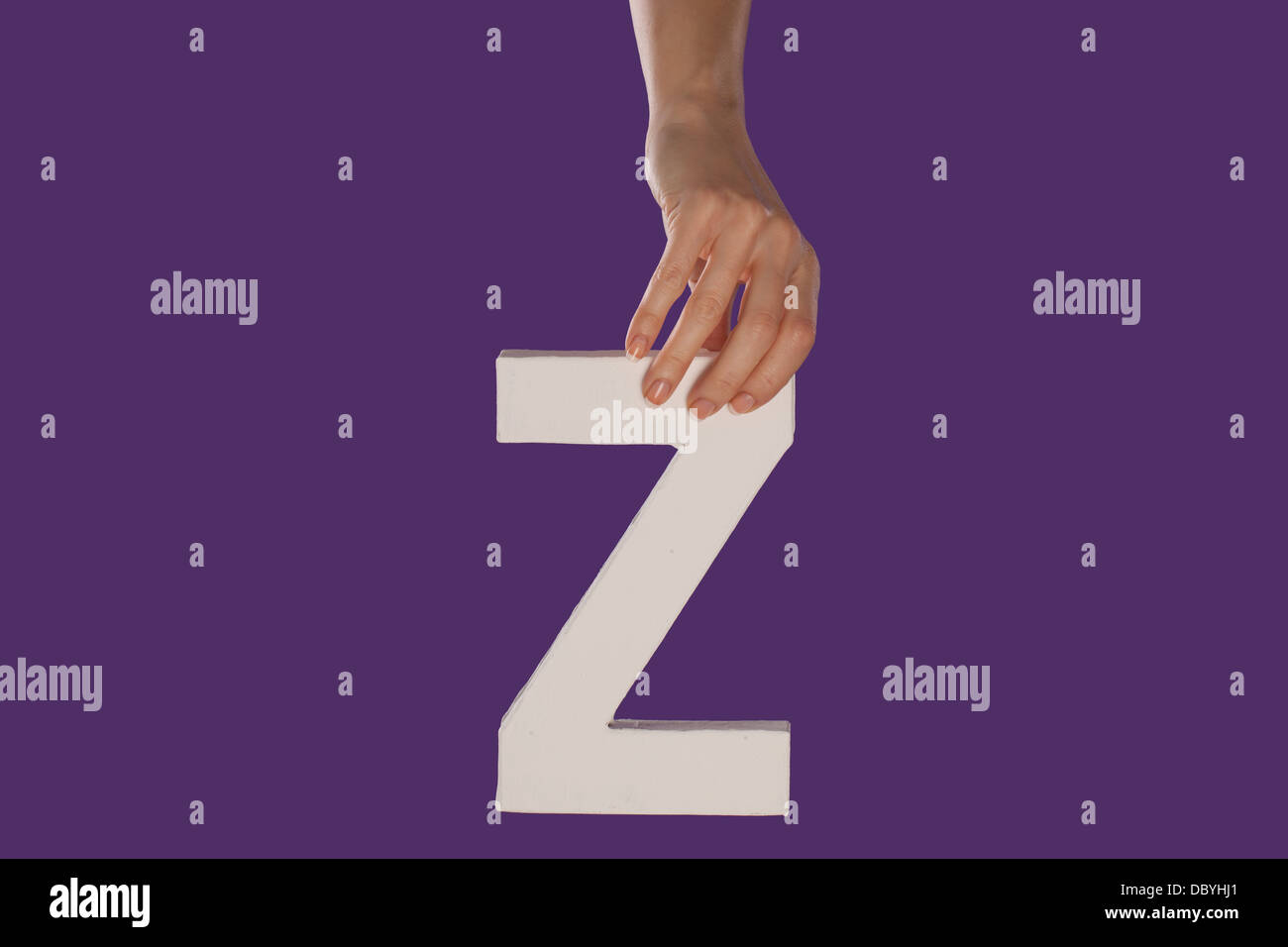 Female hand holding up the letter Z from top Stock Photo - Alamy