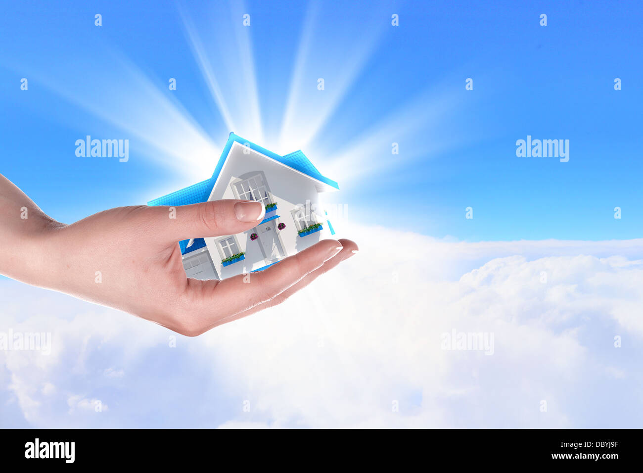 the house in hands on blue sky Stock Photo - Alamy