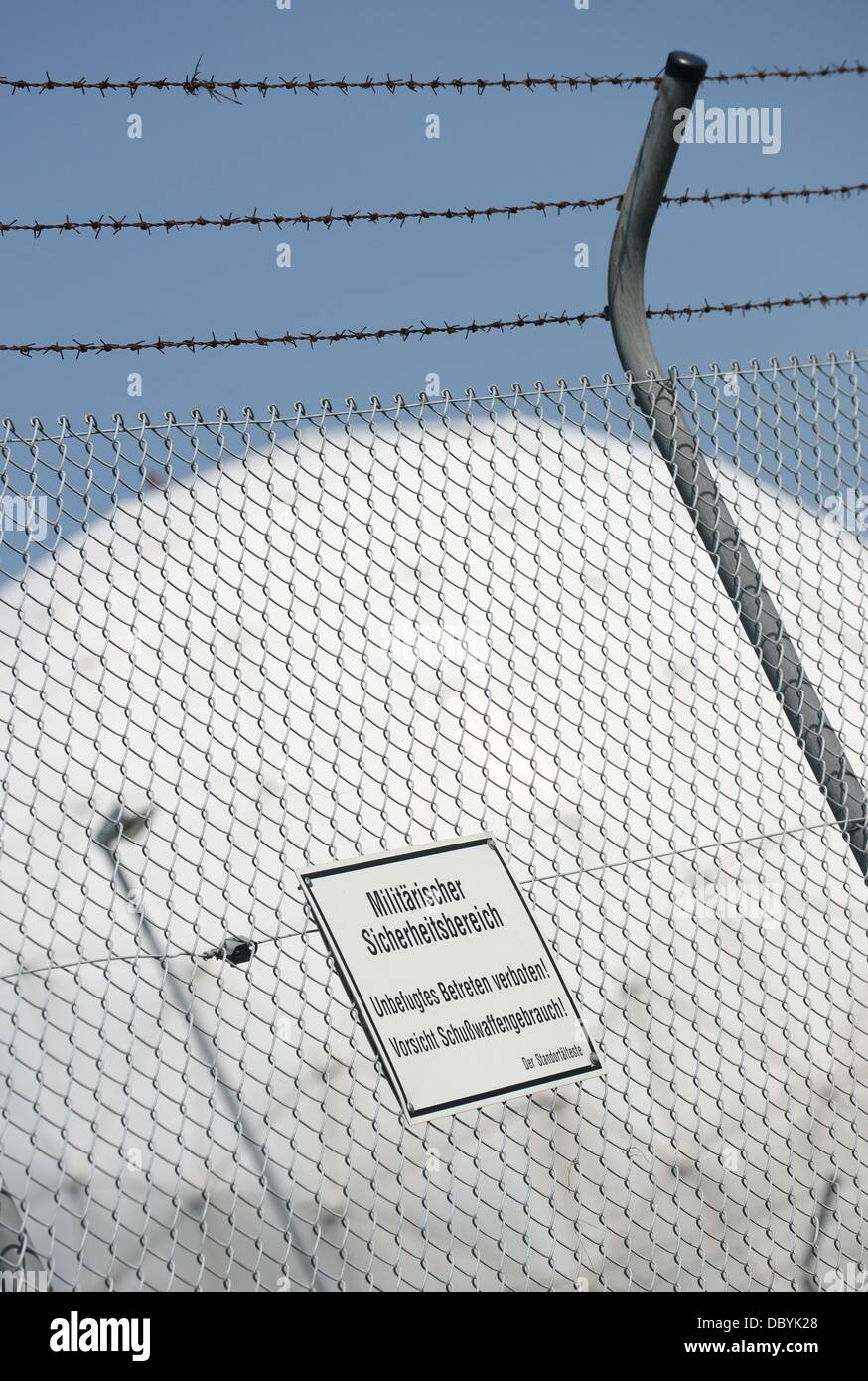 Bad Aibling, Germany. 06th Aug, 2013. Radomes (radar domes) are pictured behind a fence with a sign which reads 'Military Security Area' at the Bad Aibling Station near Bad Aibling, Germany, 06 August 2013. Bad Albing Station was a large spy station of US intelligence organization NSA (NAtional Security Agency). Photo: ANDREAS GEBERT/dpa/Alamy Live News Stock Photo
