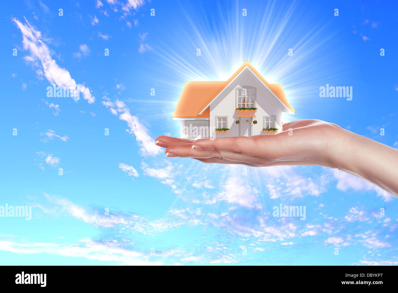 the house in hands on blue sky Stock Photo - Alamy