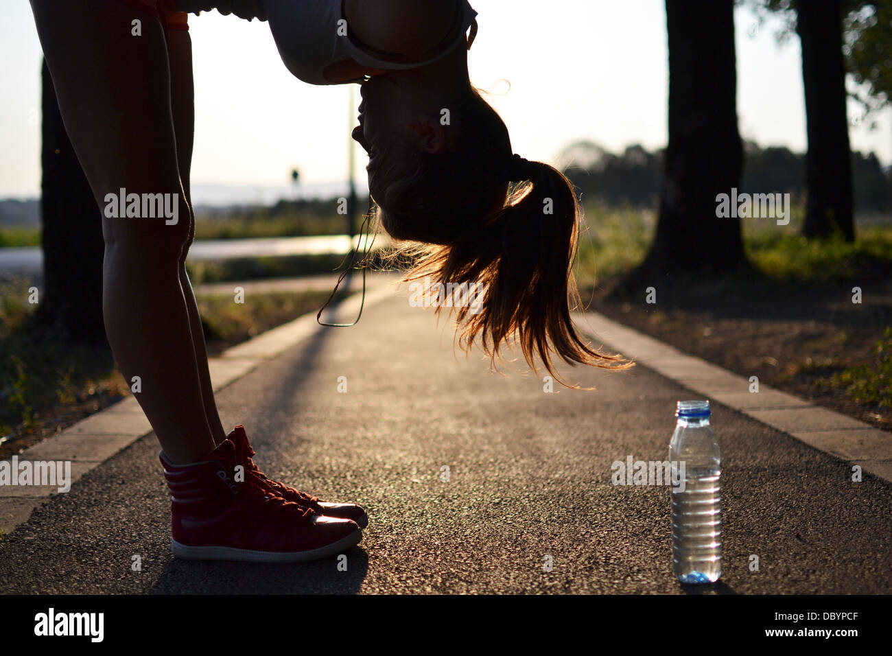 young woman working out in the park Stock Photo