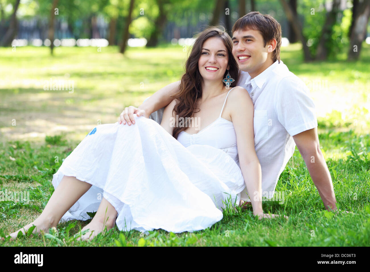 Young love Couple smiling under blue sky Stock Photo - Alamy