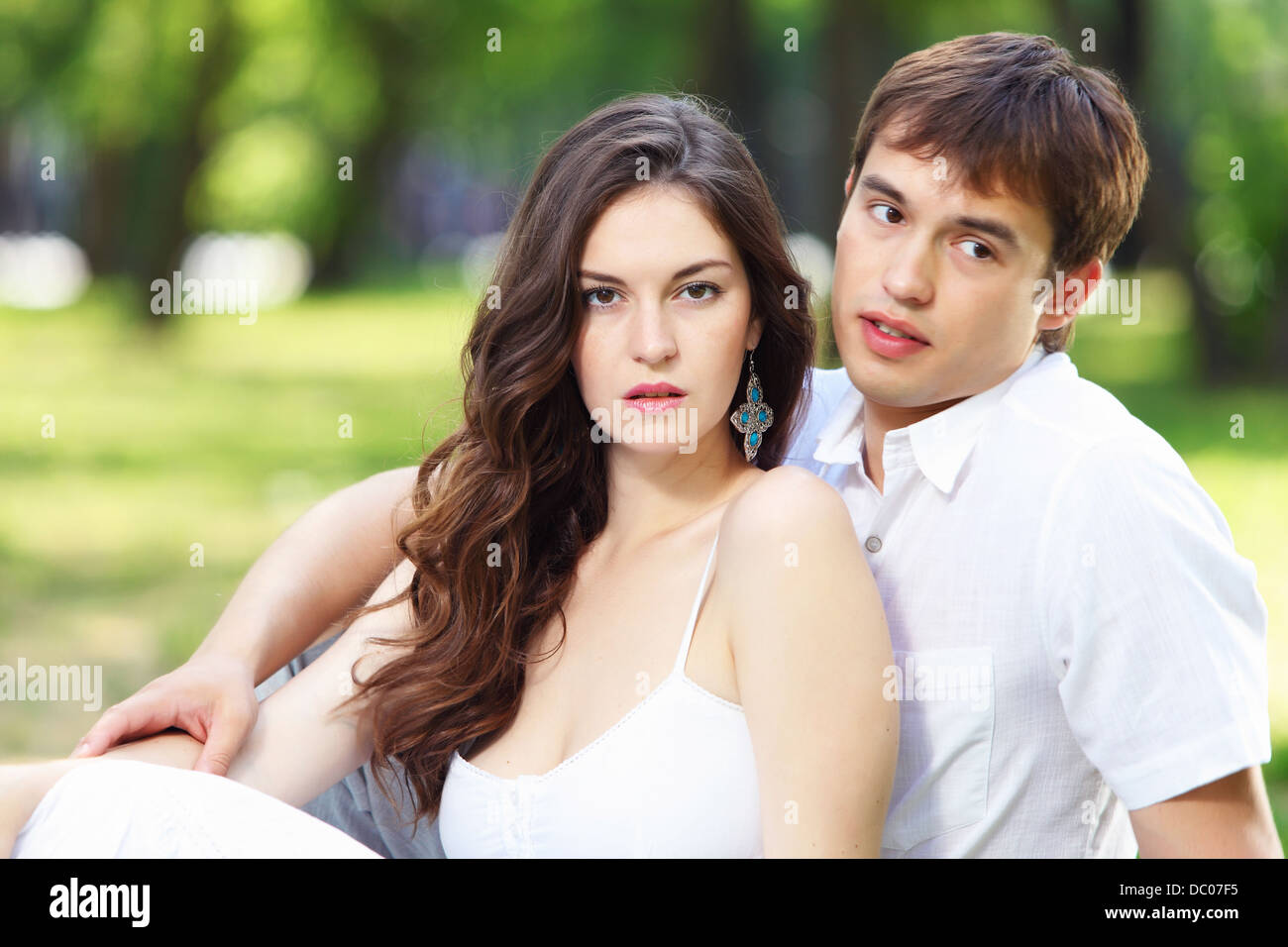 Young love Couple smiling under blue sky Stock Photo - Alamy