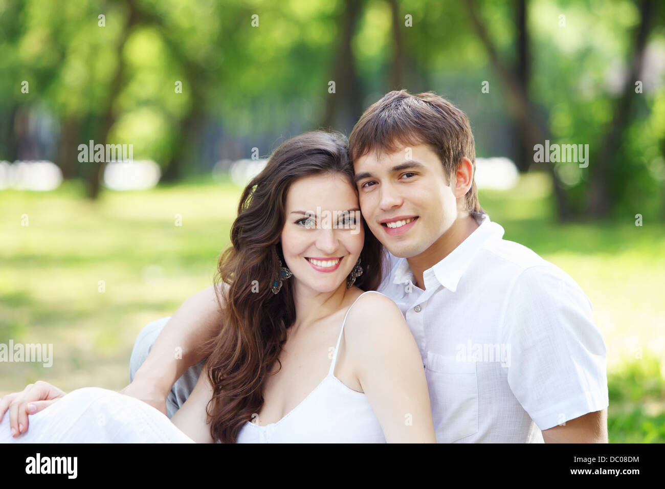 Young love Couple smiling under blue sky Stock Photo - Alamy