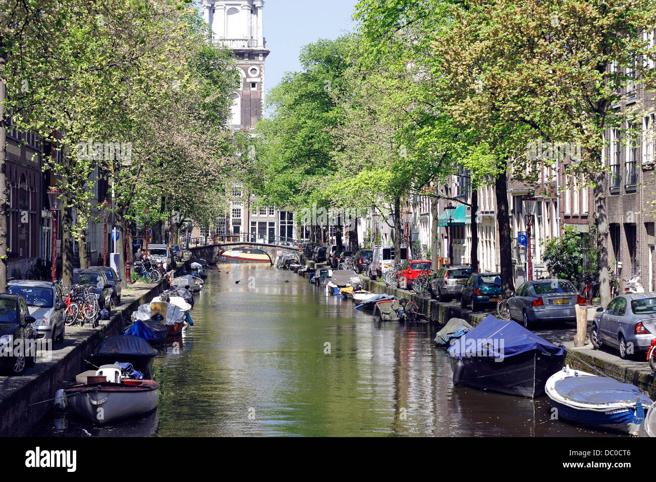 Amsterdam Netherlands Holland Europe small boats along canal Groenburgwal Stock Photo