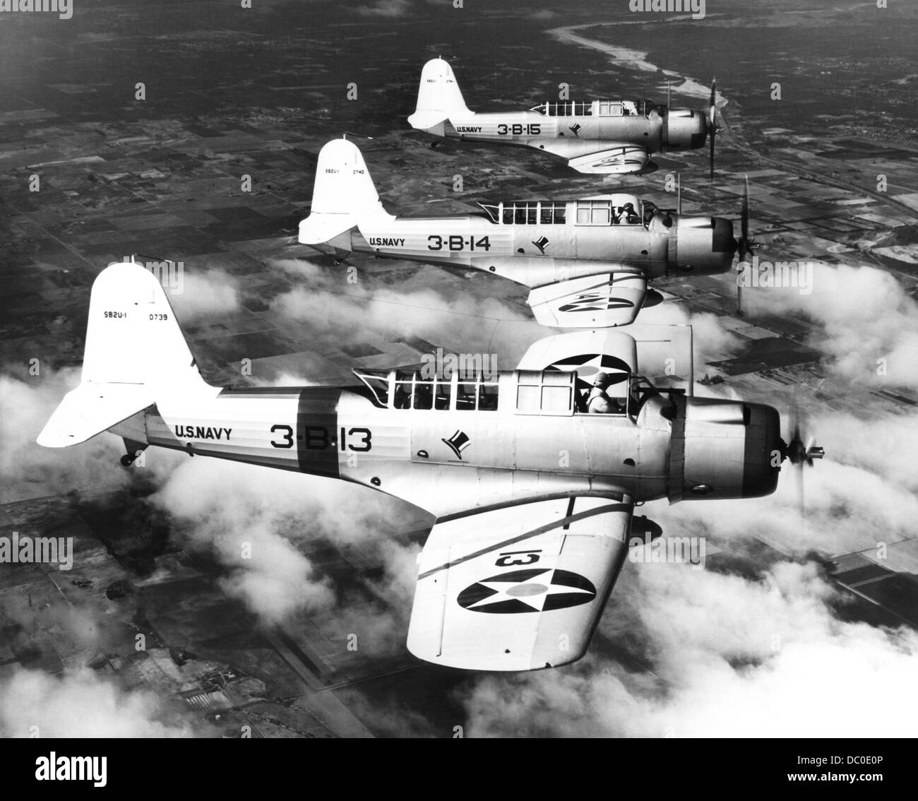 1940s THREE WORLD WAR II US NAVY DIVE BOMBERS FLYING IN FORMATION Stock Photo