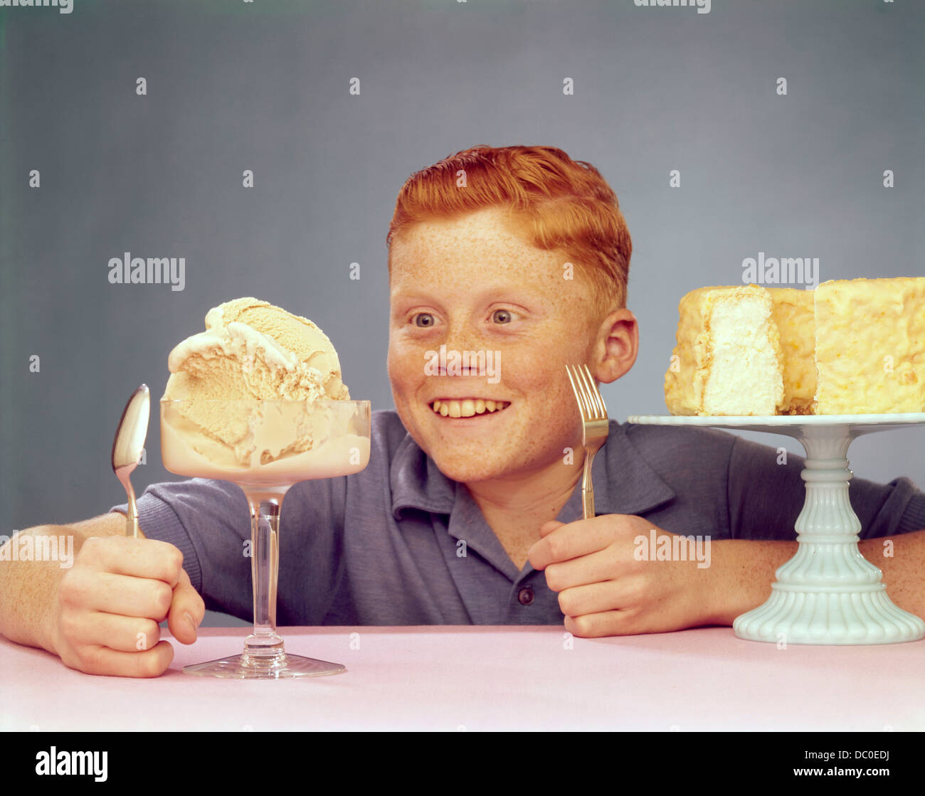 1950s RED HEAD JUVENILE BOY WITH ICE CREAM AND CAKE Stock Photo Alamy