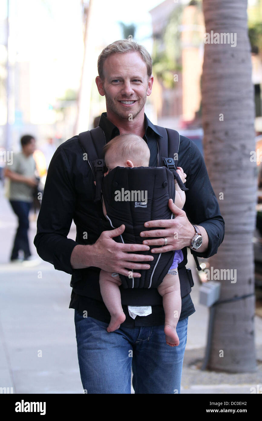 Ian Ziering carries his newborn daughter Mia Loren in a Britax baby
