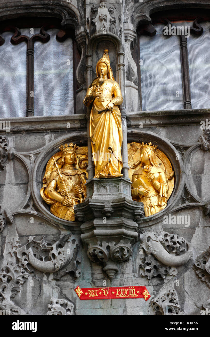 Bruges Belgium Flanders Europe Brugge gilded statue Basilica of the Holy Blood facade Stock Photo