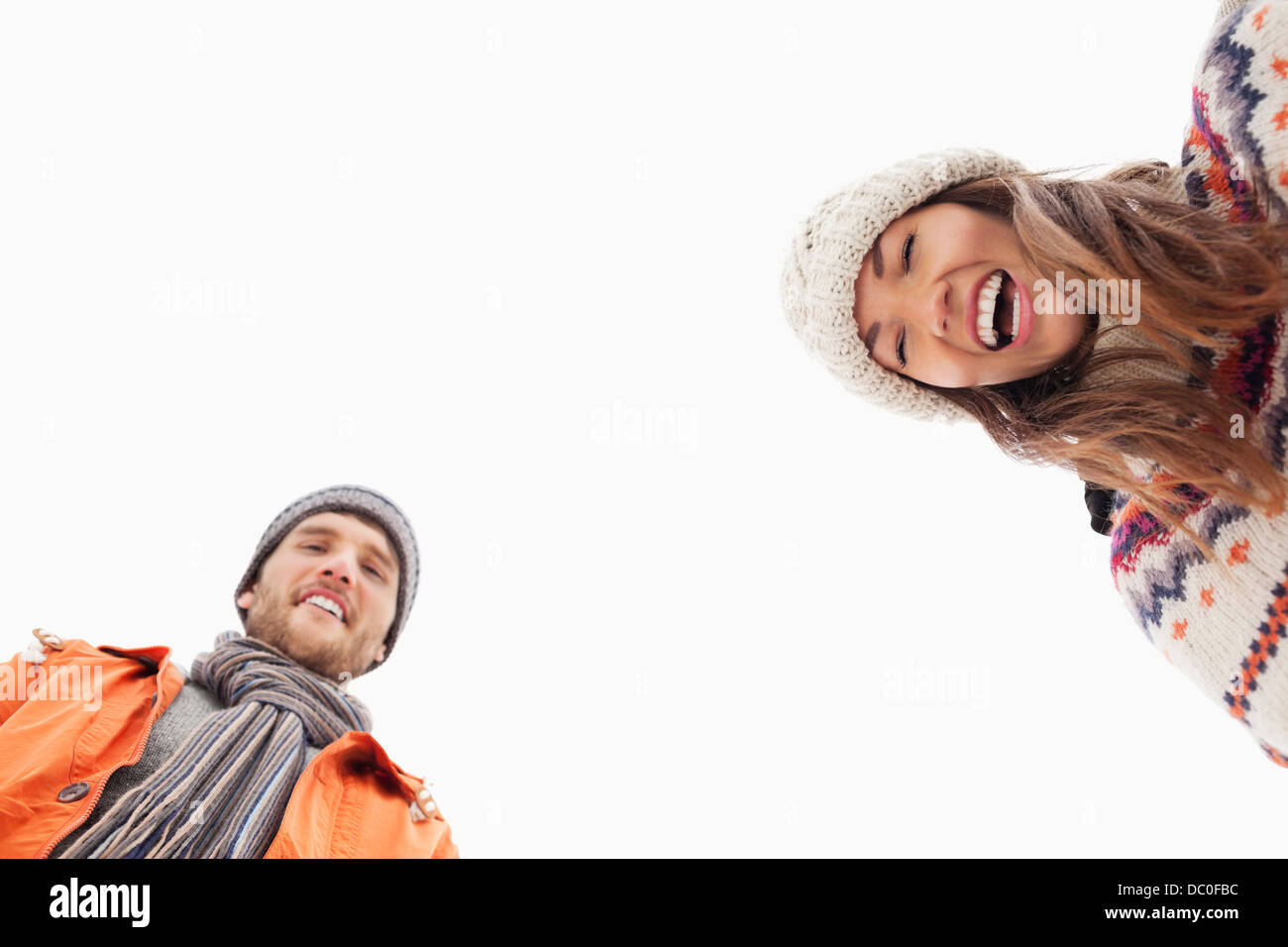 Low angle portrait of laughing couple Stock Photo