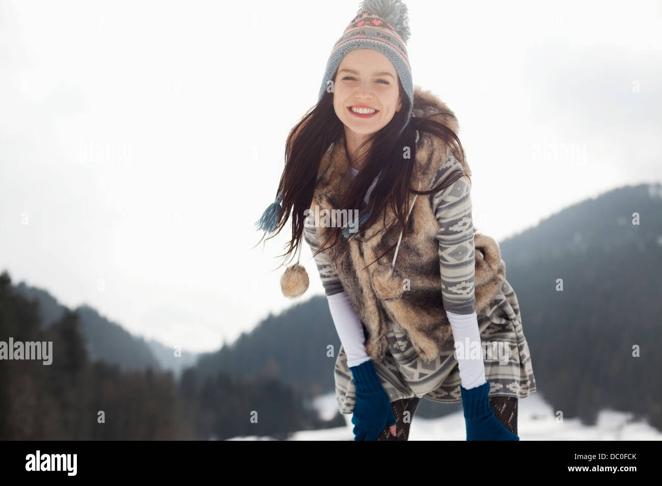 Portrait of happy woman in snow Stock Photo