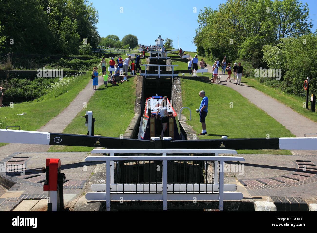 A narrowboat ascending Foxton Locks, on the Grand Union Canal, the largest flight of staircase canal locks in England Stock Photo