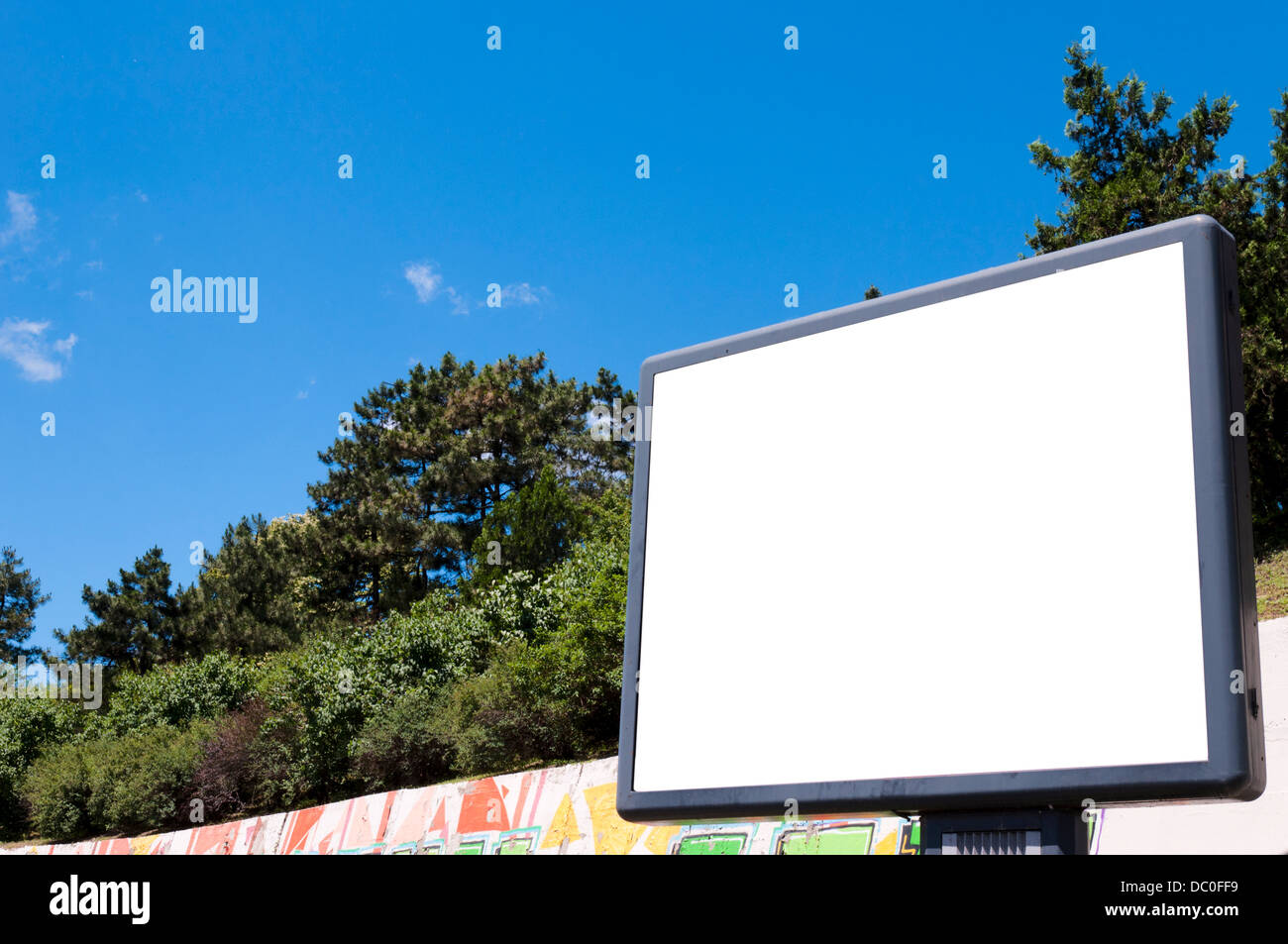 Big blank billboard in the city with trees in background Stock Photo ...
