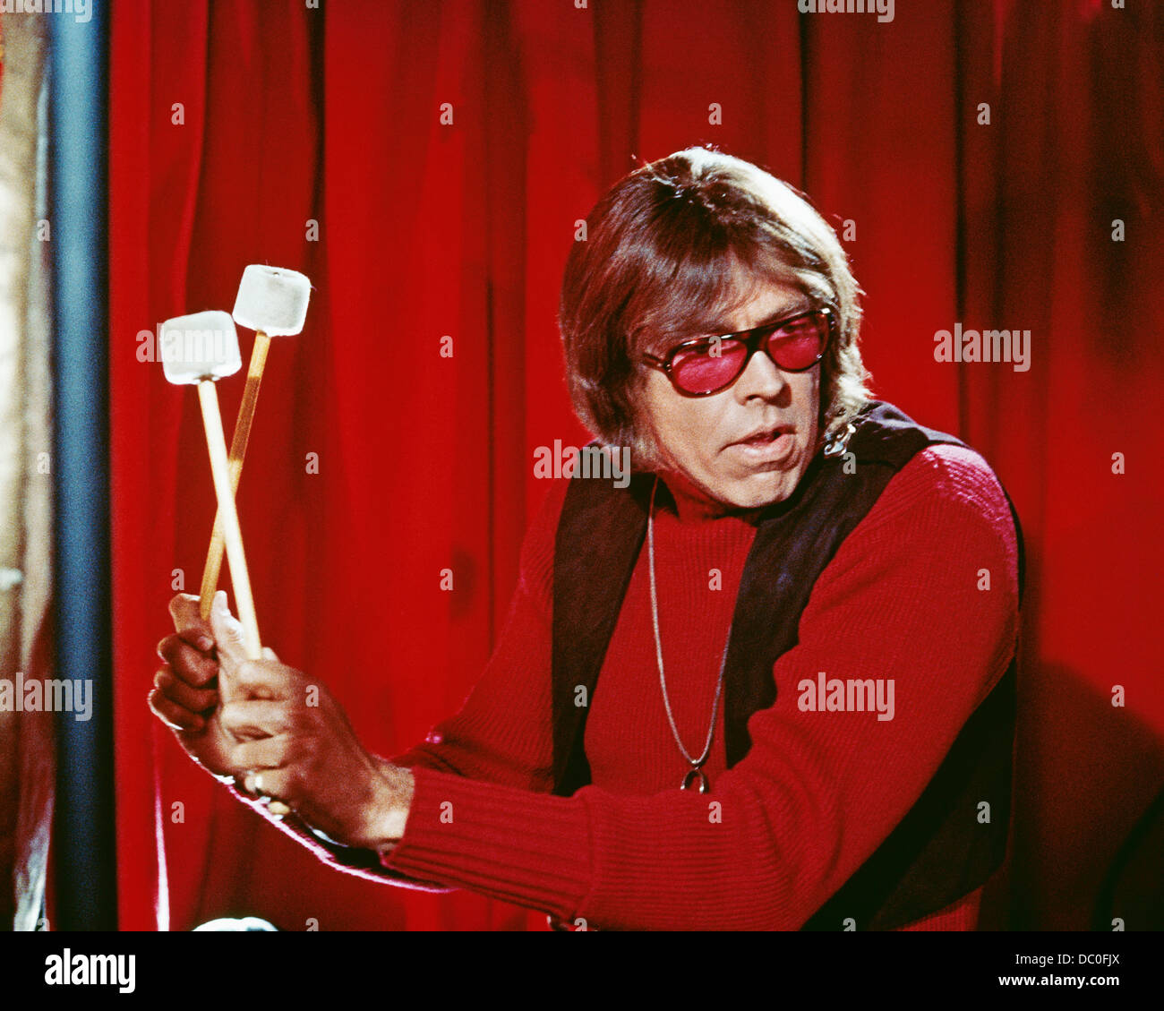 1960s 1967 MOTION PICTURE THE PRESIDENT'S ANALYST STAR JAMES COBURN PLAYING DRUMS Stock Photo