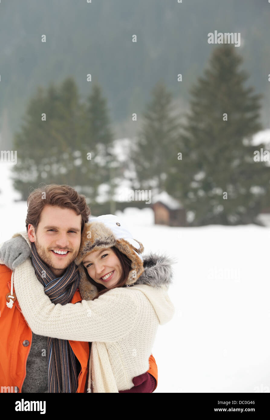 Couple hugging snow hi-res stock photography and images - Alamy