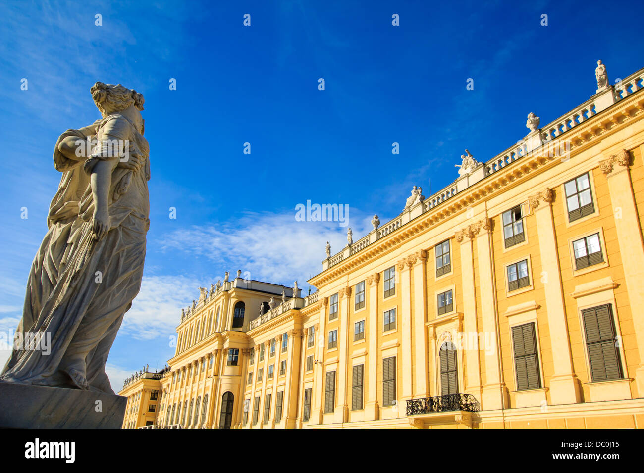 Vienna - Greek statue with the Schonbrunn palace on the background. Stock Photo